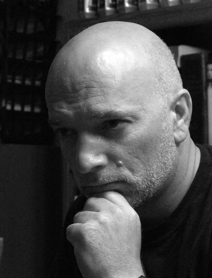 A photo of author Adam K Watts in his portrayal of The Thinker